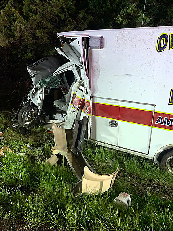 EXTENSIVE DAMAGE to the Owensville Area Ambulance District’s 2019 Ford E-450 ambulance cab and truck box is evident from the impact of an eastbound car — turned upside down and sliding backward — which came into the crew’s westbound U.S. 50 lane on Friday evening. Both crew members were injured; one seriously.